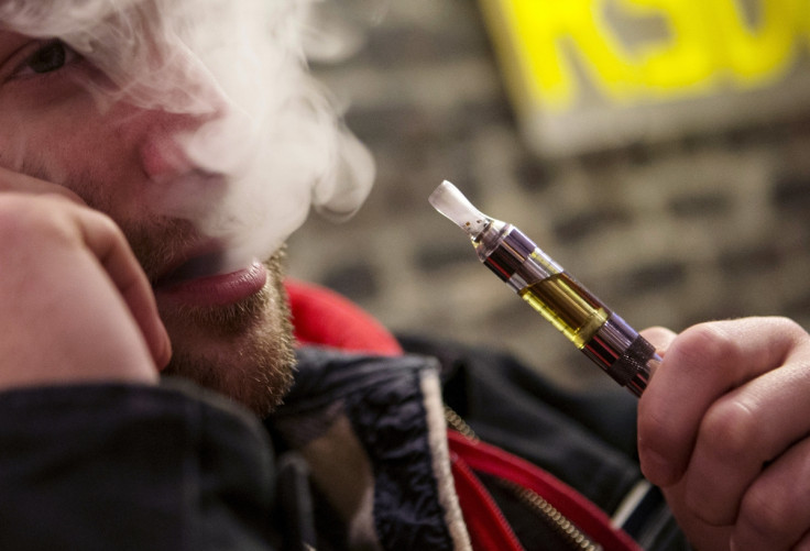 Man enjoys e-cigerette in New York, containing nicotine and not tar Man enjoys e-cigerette in New York, containing nicotine and not tar
