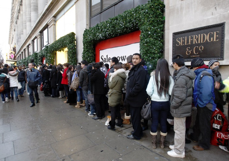 Shoppers queue outside Selfridges on London's Oxford Street.