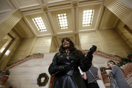 Dominatrix Terri-Jean Bedford, one of three current and former sex workers who initiated a challenge to Canada's prostitution laws, reacts at the Supreme Court of Canada in Ottawa
