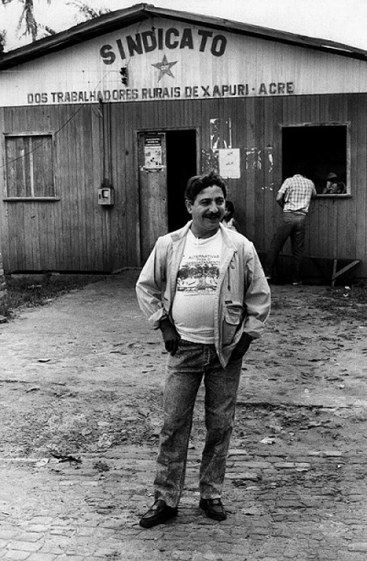 Chico Mendes stands outside the headquarters of his rubber tappers' union in the Amazonian city of Xapuri, Acre state, in December 1988.