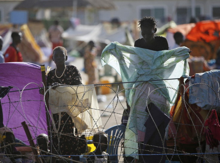 Internally displaced people stand inside a United Nations Missions in Sudan (UNMIS) compound in Juba, South Sudan.