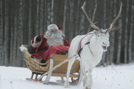 A man dressed as Santa Claus rides his sleigh as he prepares for Christmas on the Arctic Circle in Rovaniemi, northern Finland.