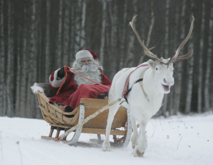 A man dressed as Santa Claus rides his sleigh as he prepares for Christmas on the Arctic Circle in Rovaniemi, northern Finland.