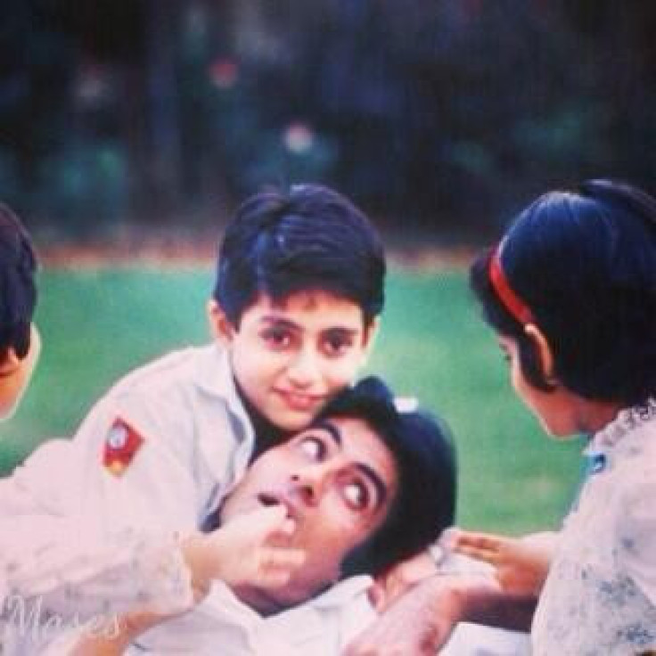 A file photo of young Abhishek Bachchan with his father Amitabh Bachchan at their Mumbai residence, Prateeksha.