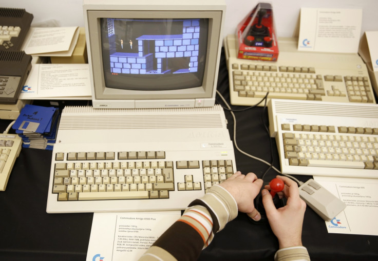 Boy plays a classic Commodore computer game.