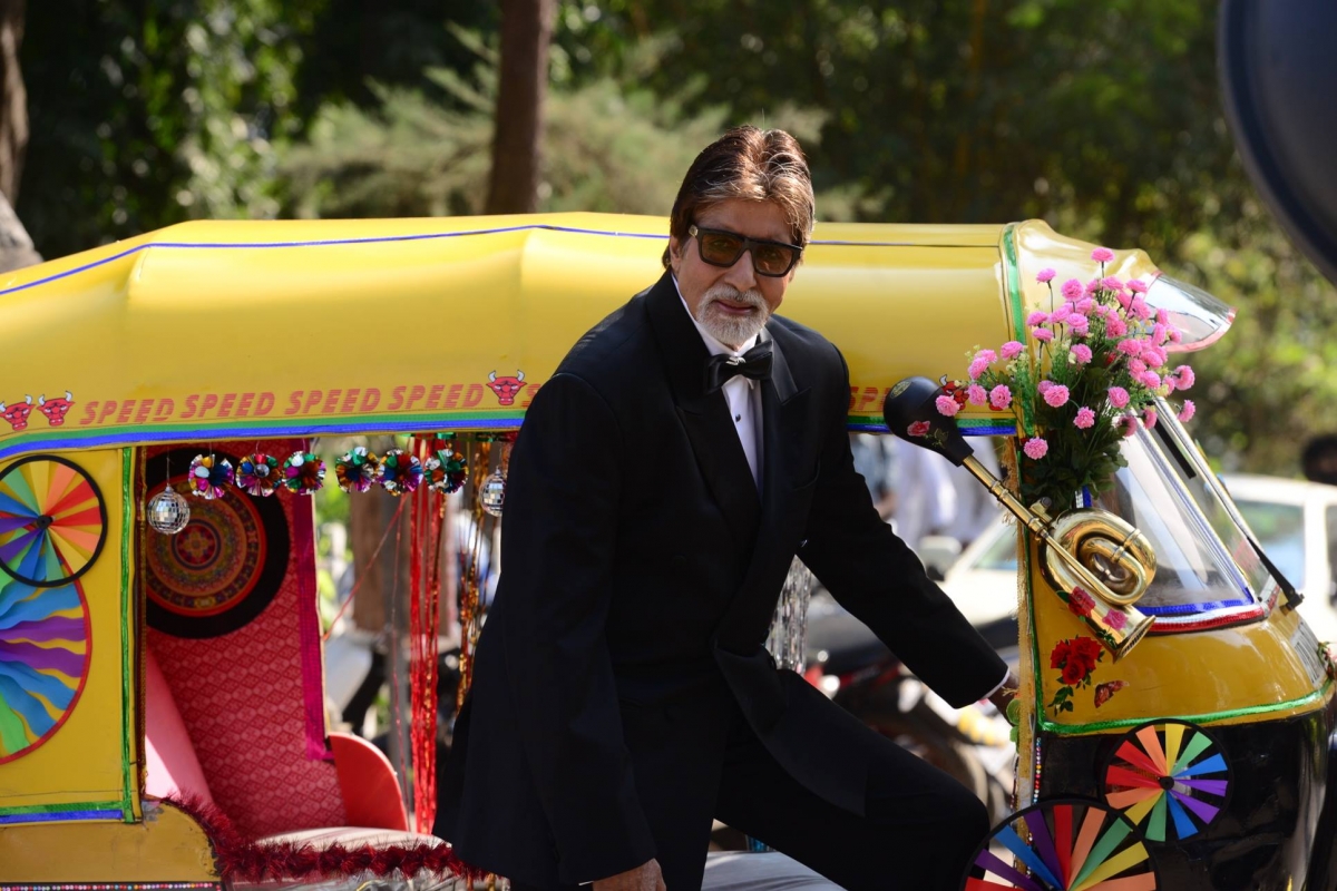 Amitabh Bachchan poses with auto rickshaw for Dabboo Ratnani calendar shoot in Mumbai.
