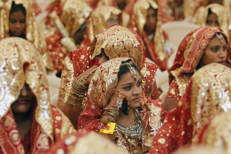 Brides wait for their weddings to start during a mass marriage ceremony in the western Indian city of Ahmedabad February 22, 2013.