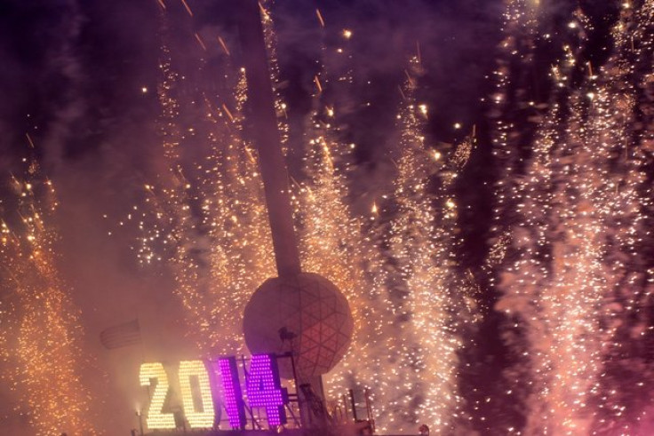 Fireworks explode past the Times Square Ball after it dropped to signal the start of the new year in Times Square, Midtown, New York