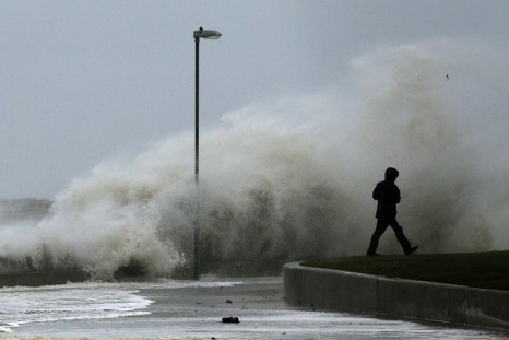Tidal wave breaks on the promenade in Rhyl, north Wales.