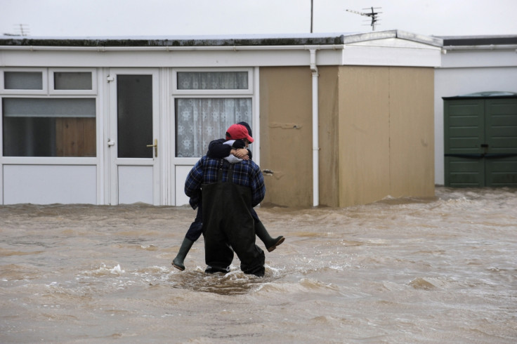 Holiday chalets at Carmarthen Bay Holiday Park are surrounded by flood water caused by high tides in Kidwelly, West Wales.