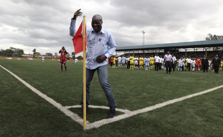 Former Cameroon player Roger Milla dances at the corner flag after meeting young Kenyan players in 2010.