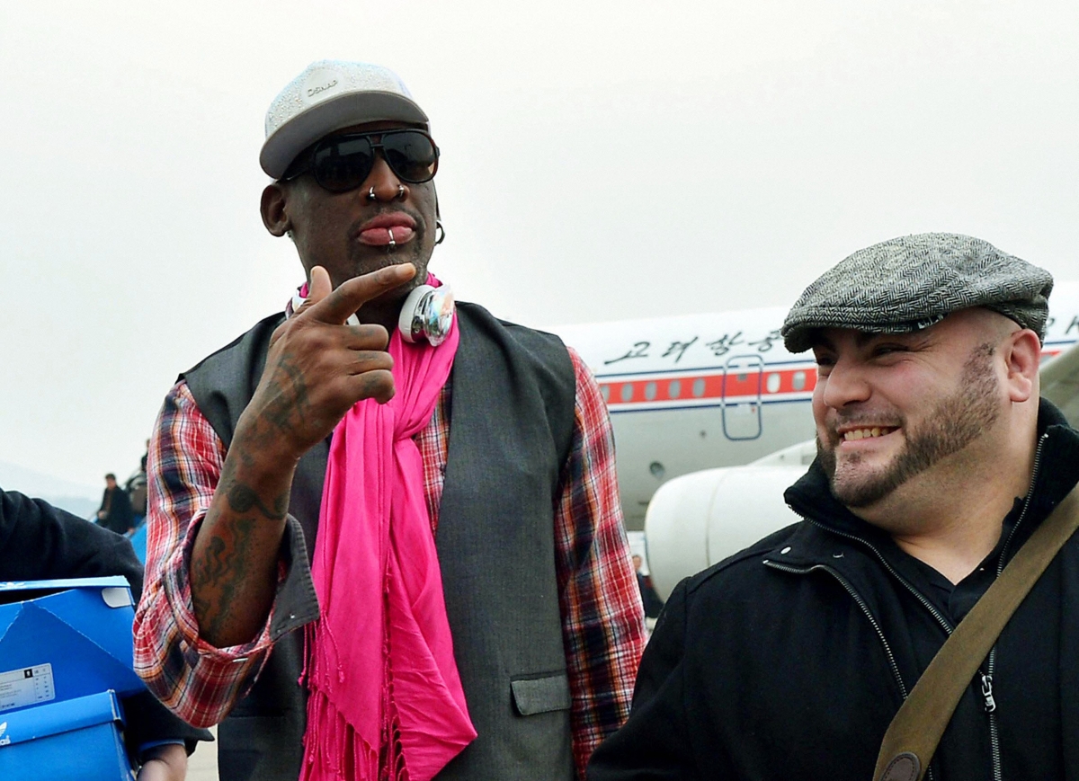 Dennis Rodman touches down in Pyongyang with former NBA players for a match to mark Kim Jong-Un's birthday