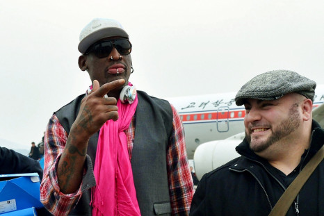 Dennis Rodman touches down in Pyongyang with former NBA players for a match to mark Kim Jong-Un's birthday
