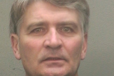 Former UBS banker Raoul Weil is seen in a booking photo after his arrival at the Broward Sheriff's Office in Fort Lauderdale, Florida December 13, 2013
