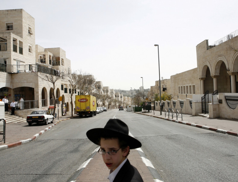 An ultra-Orthodox Jewish boy walks in Ramat Shlomo