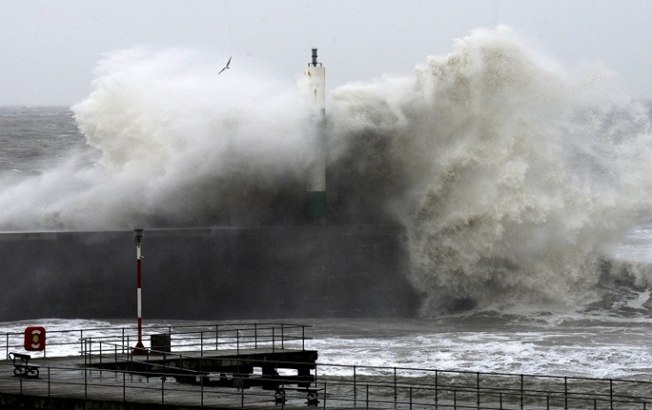 Large waves crash over the jetty at Aberystwyth