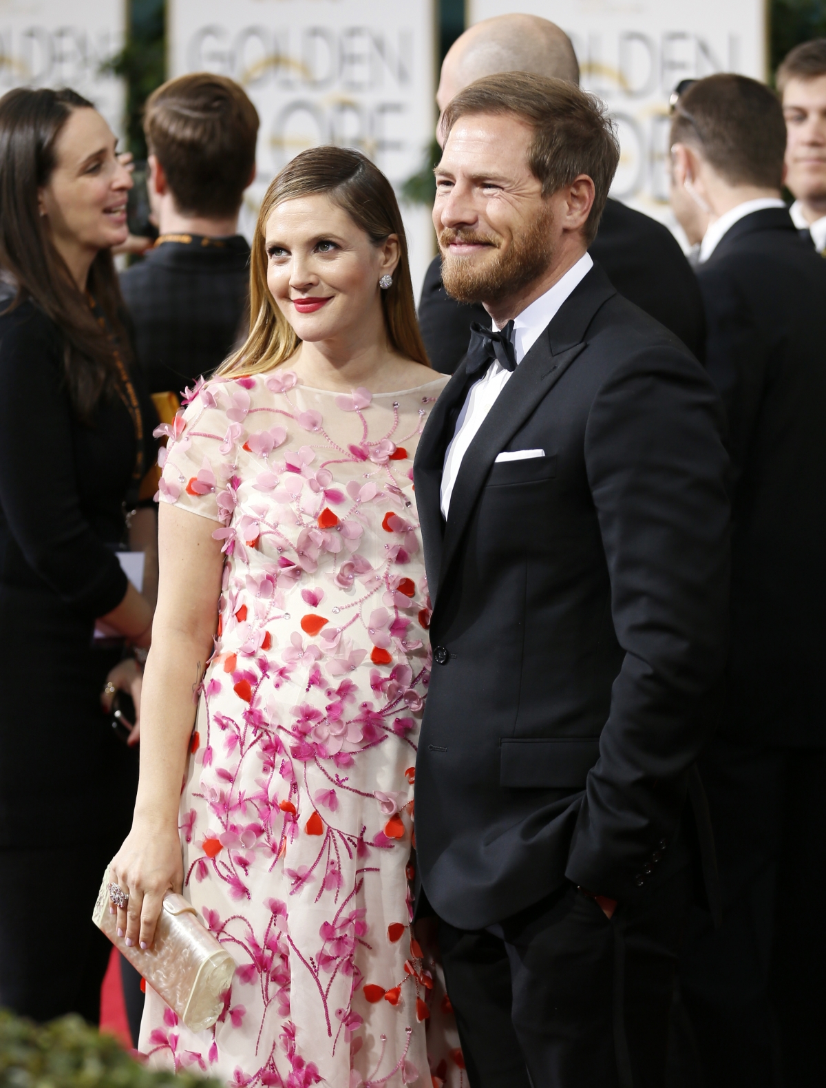 Actress Drew Barrymore and husband, Will Kopelman, arrive at the 71st annual Golden Globe Awards in Beverly Hills, California January 12, 2014.