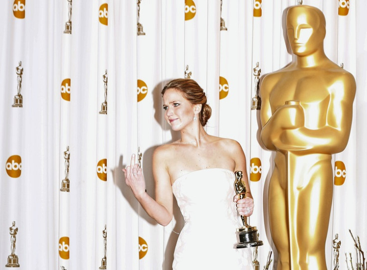 Jennifer Lawrence flipped the bird at reporters after she fell up the stairs at last year's Academy Awards