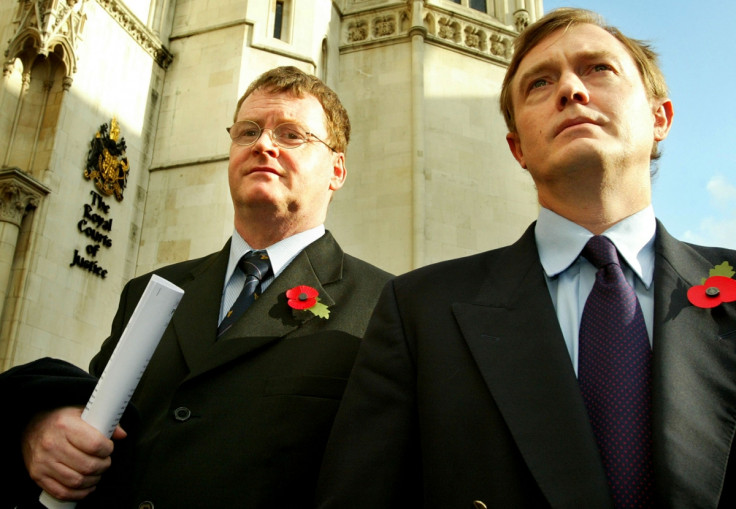 Britain's Sandy Mitchell (L) and Canada's Bill Sampson leave the High Court in London, October 28, 2004.