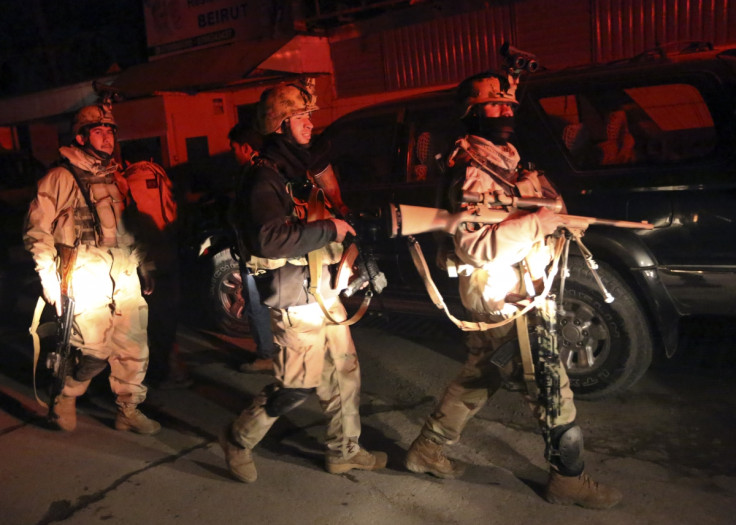 Afghan security forces arrive at the scene of an explosion in Kabul