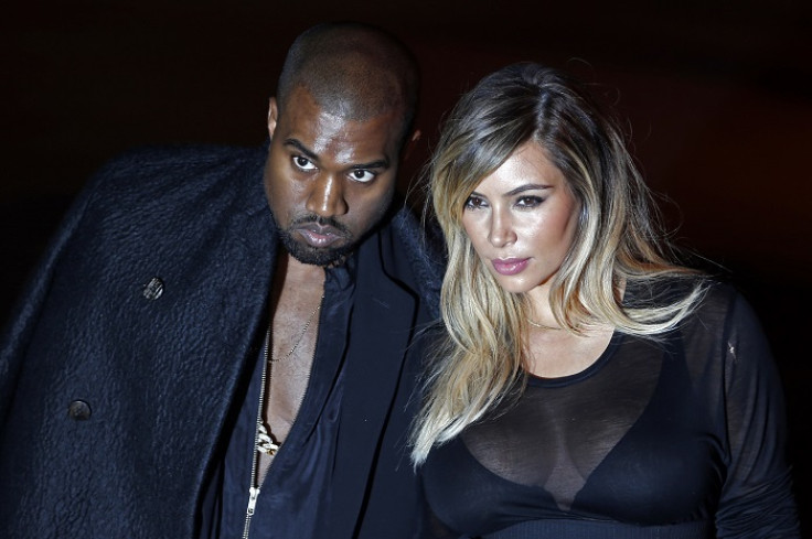 Kim Kardashian with fiancé Kanye West at the Givenchy Spring/Summer 2014 women's ready-to-wear fashion show during Paris Fashion Week.