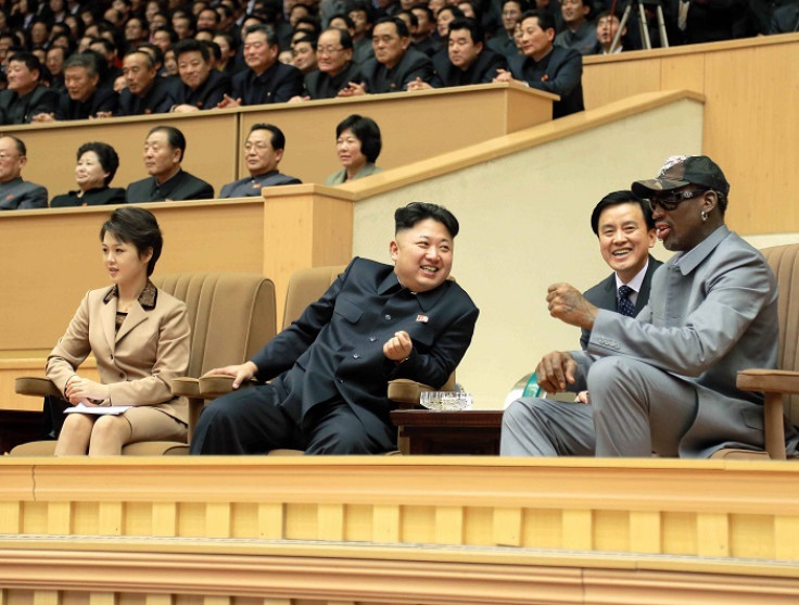 Rodman and North Korean dictator Kim Jong-un watch a basketball game at Pyongyang Indoor Stadium.
