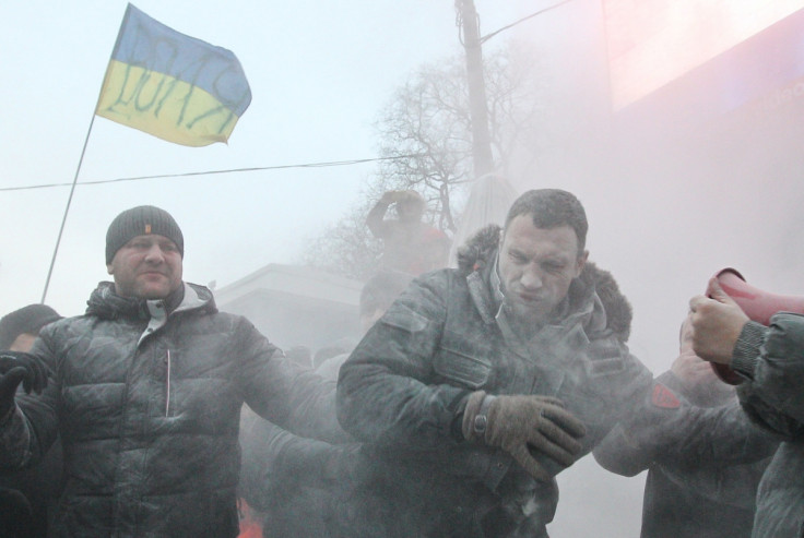 Vitaly Klitschko sprayed with powder during protests in Kiev against Ukraine's direction and new protest laws