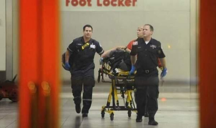 Police remove the injured from a Maryland Mall where a killer is on the loose