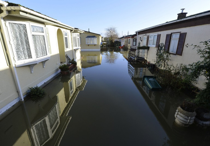 Riverside properties are seen partially submerged in floodwaters from the River Thames, at Chertsey in southern England