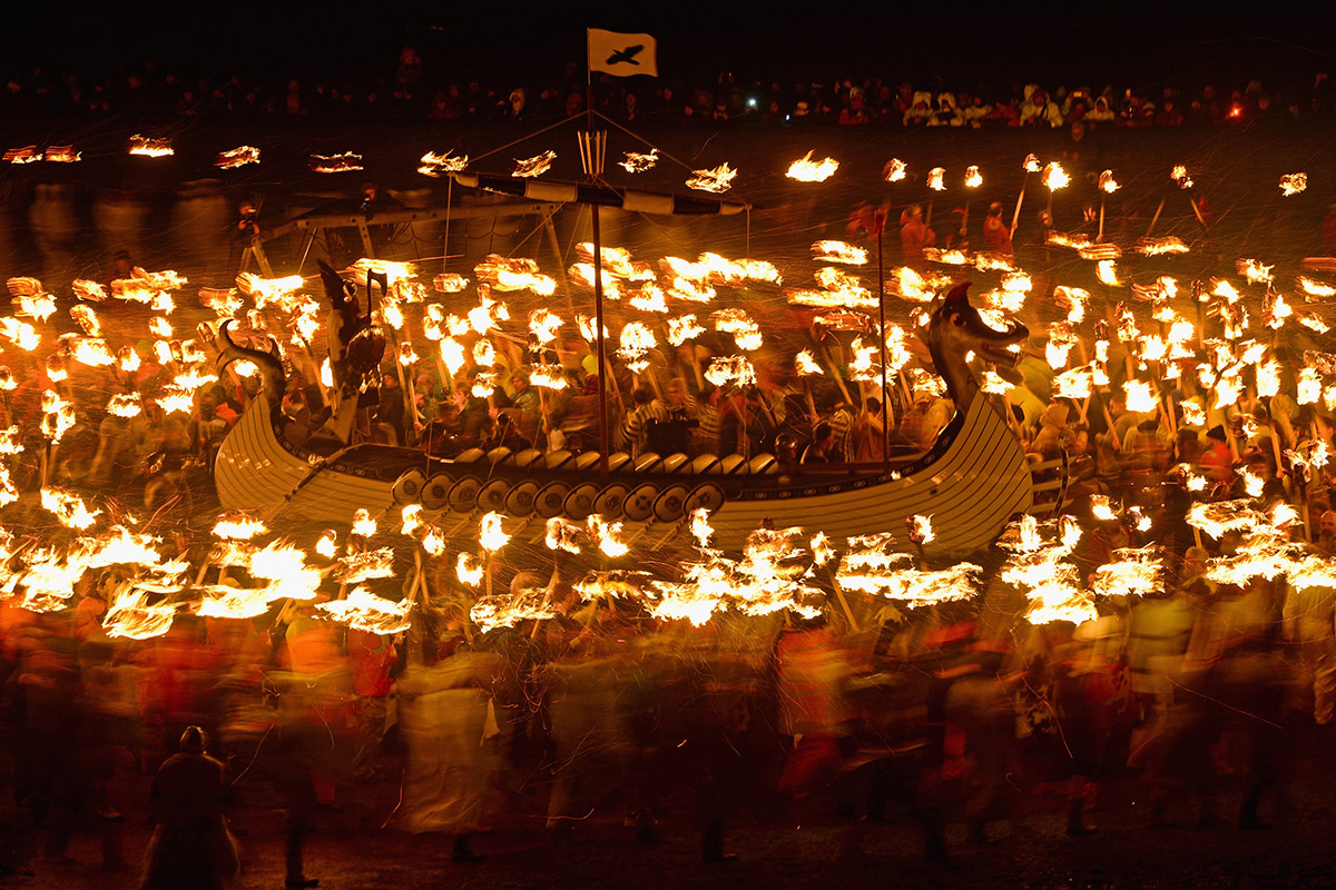 up helly aa long boat torches blur