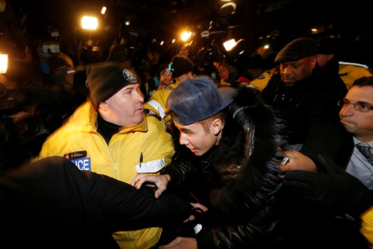 Pop singer Justin Bieber arrives at a police station in Toronto January 29, 2014.