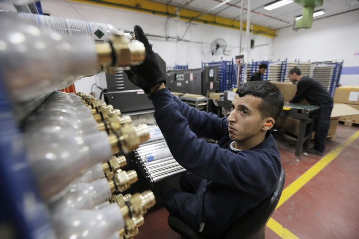 A Palestinian employee works at the SodaStream factory in the West Bank Jewish settlement of Maale Adumim