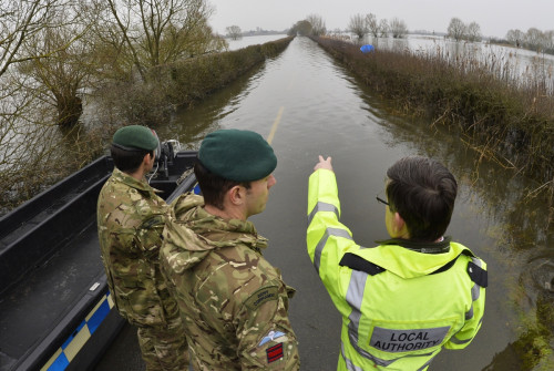 British army Royal Engineers are shown flooded areas by a local official near Muchelney village on the Somerset Levels British army Royal Engineers are shown flooded areas by a local official near Muchelney village on the Somerset Levels