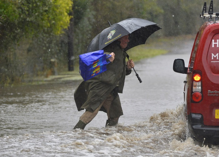 A resident wades through flooded parts of the Somerset Levels in southwest England.