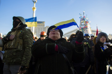 Anti-government protesters sing the Ukrainian national anthem during a rally at Independence Square in Kiev.