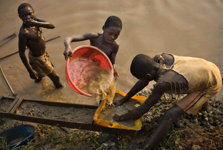 Gold mining in DRC young boys pan for gold