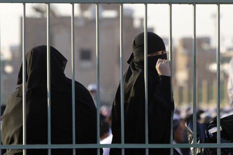 A Saudi woman looks back during prayers for Eid al-Adha in Riyadh