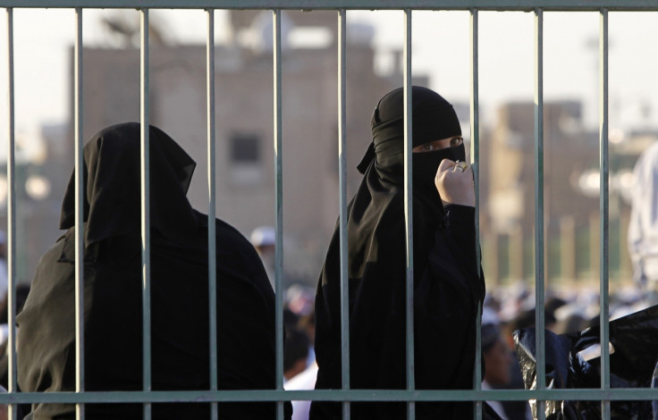 A Saudi woman looks back during prayers for Eid al-Adha in Riyadh