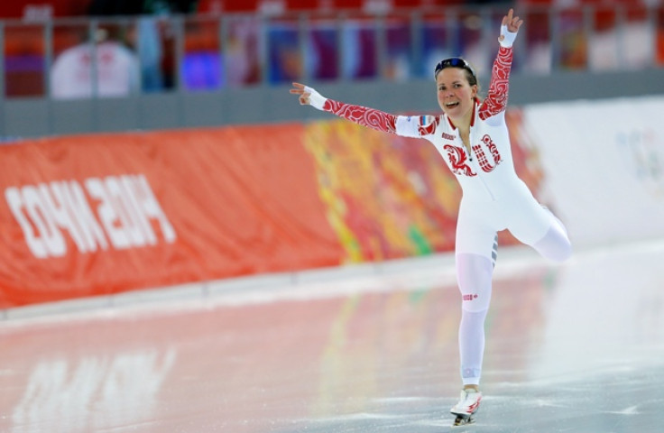 Russia's Olga Graf celebrates finishing third place in the women's 3,000 metres speed skating race