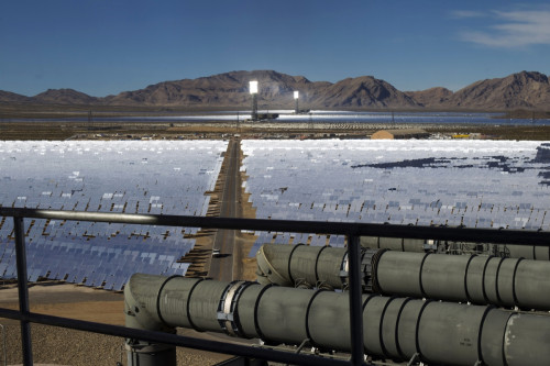 Heliostats reflect sunlight onto boilers in towers during the grand opening of the Ivanpah Solar Electric Generating System in the Mojave Desert near the California-Nevada border Heliostats reflect sunlight onto boilers in towers during the grand opening of the Ivanpah Solar Electric Generating System in the Mojave Desert near the California-Nevada border