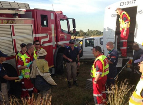 A rescued miner is examined by emergency services before being handed over to South African police. A rescued miner is examined by emergency services before being handed over to South African police.