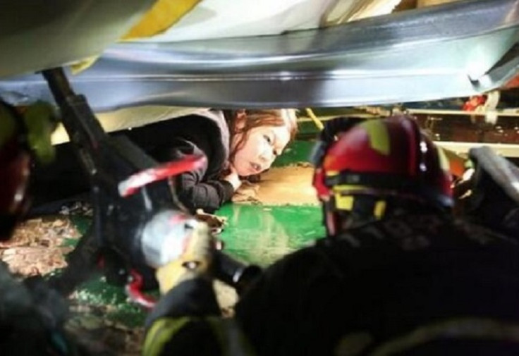 Fire crews help the trapped victims of a building collapse in South Korea