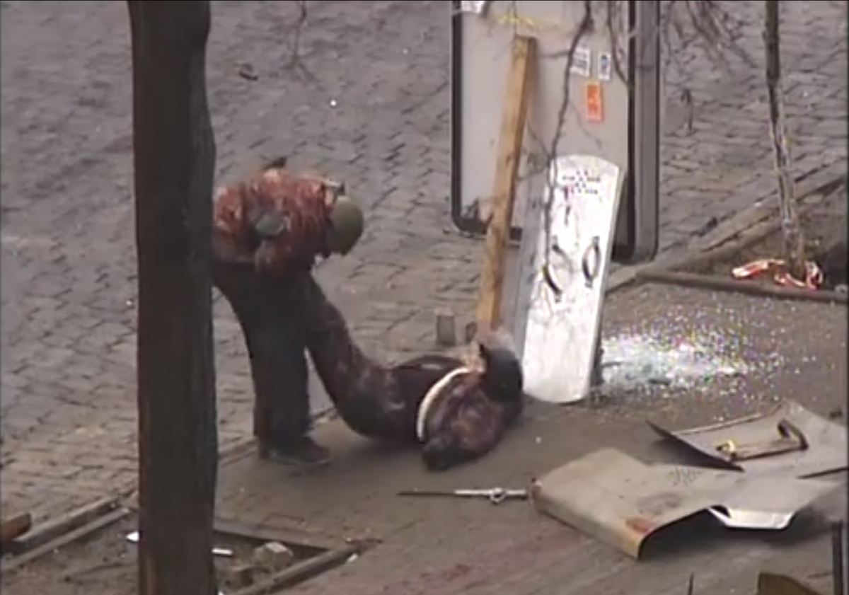The footage shows a protester dragging an injured man to safety Ukraine Sniper Kiev Independence