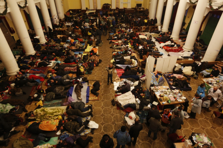 Anti-government protesters sleep in City Hall in Kiev
