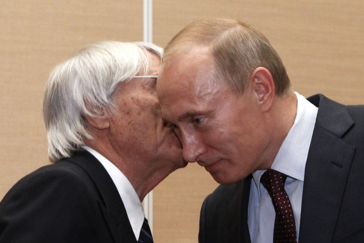 So close: Bernie Ecclestone and Vladimir Putin share a personal moment