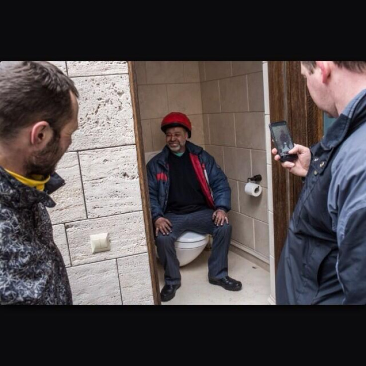 Protestors take time to investigate the private quarters of ousted president Yanukovich