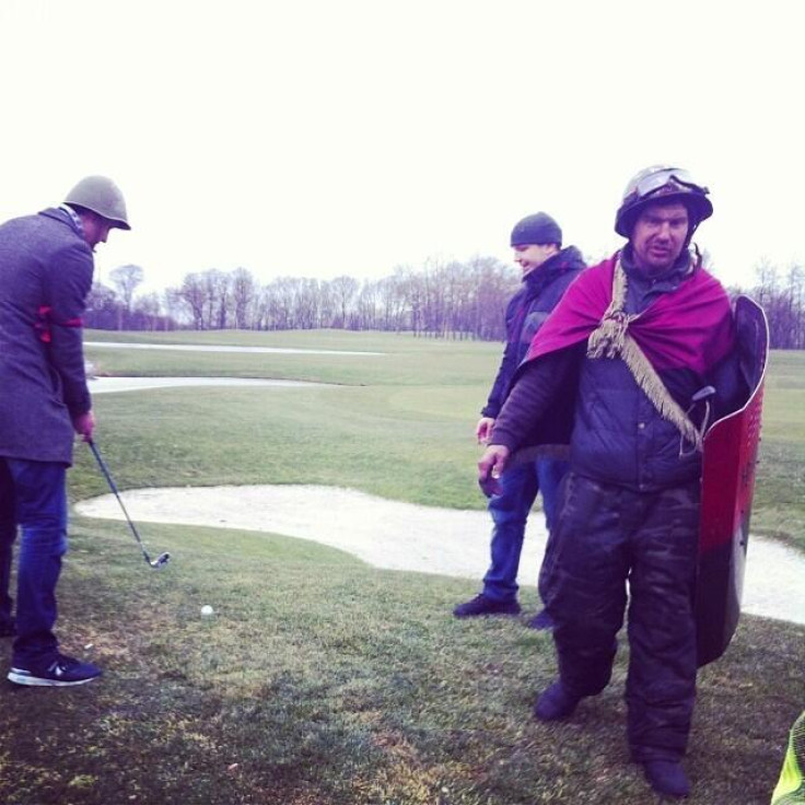 Uninvited guests at the palace enjoy a round of golf