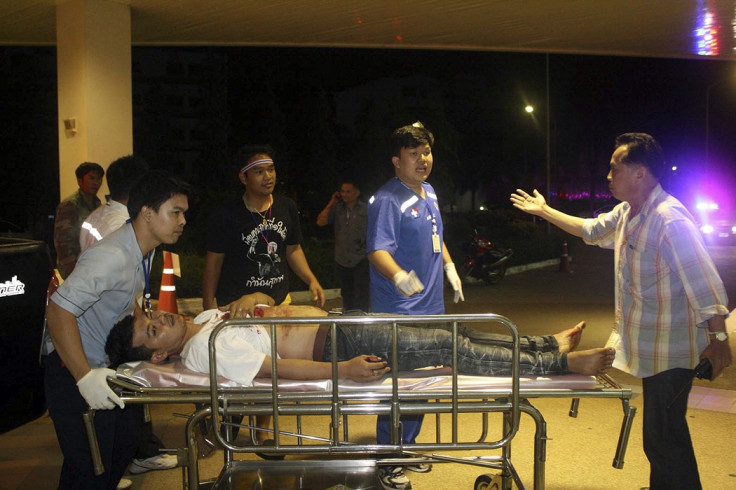 A man who was injured in an attack during an anti-government protest is wheeled by rescue workers at a hospital in Khao Saming district, Trat province February 22, 2014.