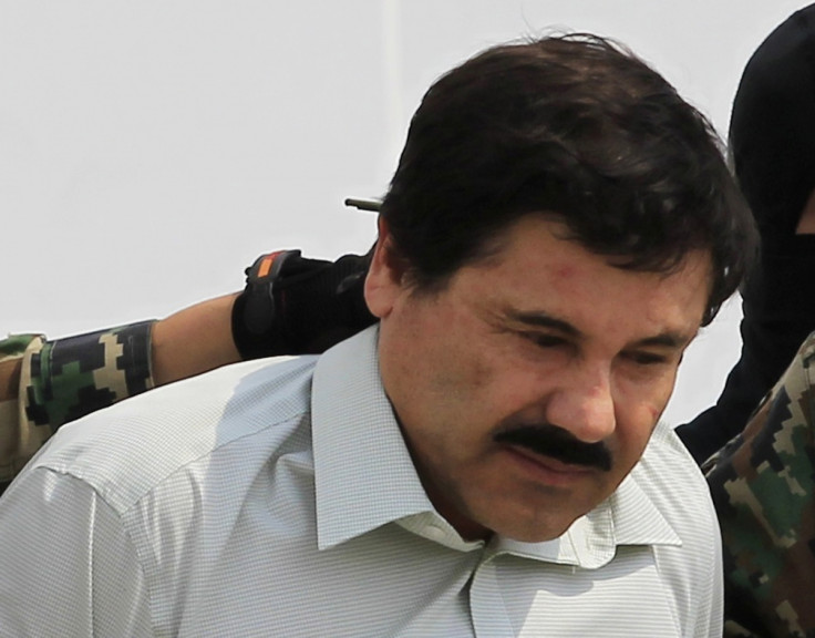 Joaquin "Shorty" Guzman, escorted by soldiers, is paraded before the media at the Navy's airstrip in Mexico City.