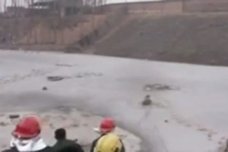 Dramatic footage of workers rescuing children from river